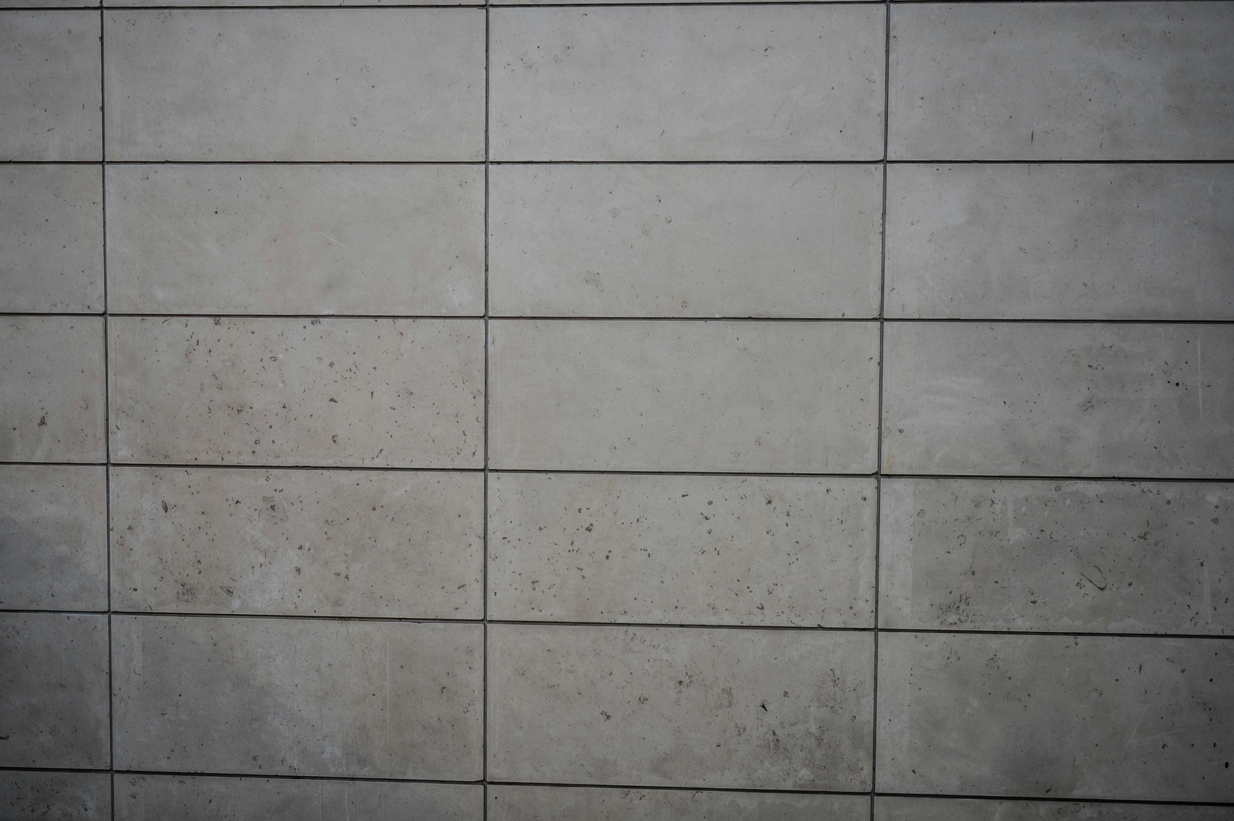 Large grey floor tiles with refined grout lines